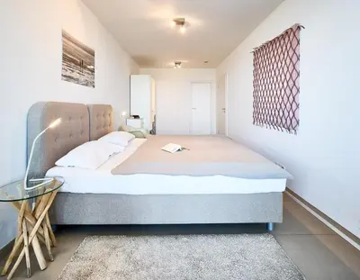 Ein Bett oder Betten in einem Zimmer der Unterkunft Düne 1, Ferienwohnung 11
