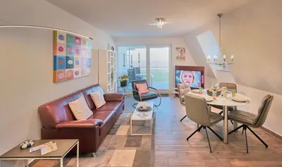 Ein Sitzbereich in der Unterkunft Düne 1, Ferienwohnung 12