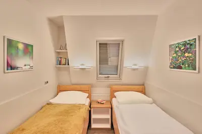 Ein Bett oder Betten in einem Zimmer der Unterkunft Düne 1, Ferienwohnung 12