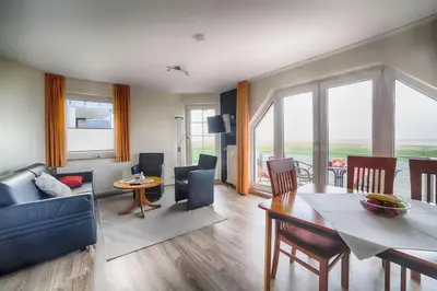 Ein Sitzbereich in der Unterkunft Dünenglück, Ferienwohnung 24