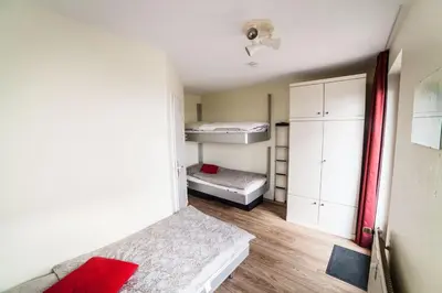 Ein Bett oder Betten in einem Zimmer der Unterkunft Dünenglück, Ferienwohnung 24