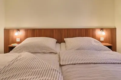 Ein Bett oder Betten in einem Zimmer der Unterkunft Dünenglück, Ferienwohnung 32