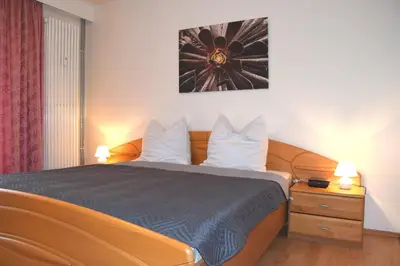 Ein Bett oder Betten in einem Zimmer der Unterkunft Hus Willem Wohnung II 23