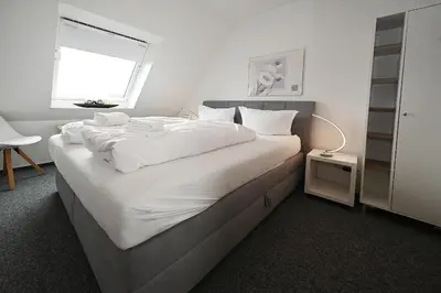 Ein Bett oder Betten in einem Zimmer der Unterkunft Seemeile 3 2