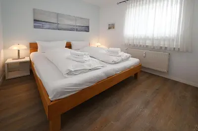 Ein Bett oder Betten in einem Zimmer der Unterkunft Seemeile 3 2