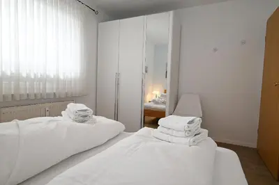 Ein Bett oder Betten in einem Zimmer der Unterkunft Seemeile 3 2
