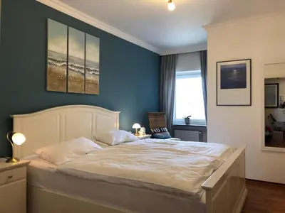 Ein Bett oder Betten in einem Zimmer der Unterkunft Büsumer Kuschelnest