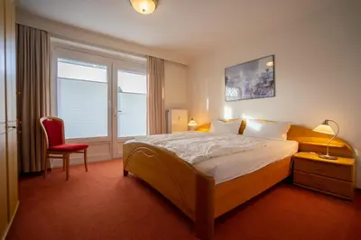 Ein Bett oder Betten in einem Zimmer der Unterkunft Hus Willem Wohnung II 15