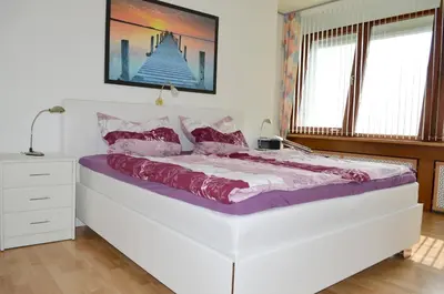 Ein Bett oder Betten in einem Zimmer der Unterkunft Büsumer Hochhaus Wohnung Jacqueline