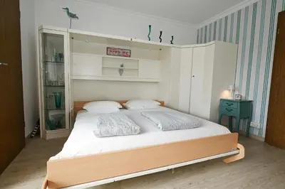 Ein Bett oder Betten in einem Zimmer der Unterkunft Büsumer Kurparkblick