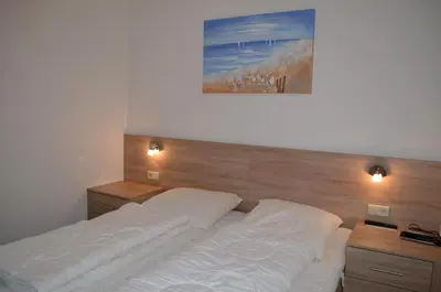 Ein Bett oder Betten in einem Zimmer der Unterkunft Strandmuschel