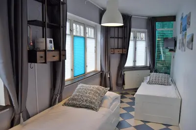 Ein Bett oder Betten in einem Zimmer der Unterkunft Villa Hafenzeit