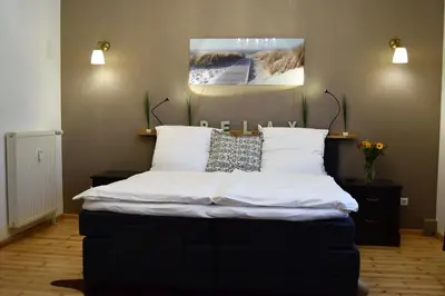 Ein Bett oder Betten in einem Zimmer der Unterkunft Villa Hafenzeit