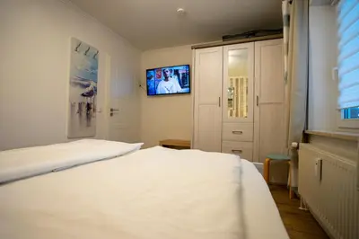 Ein Bett oder Betten in einem Zimmer der Unterkunft Seemeile 2 9
