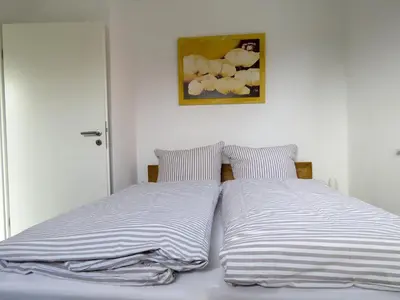 Ein Bett oder Betten in einem Zimmer der Unterkunft Haus zwischen den Deichen Wohnung 1