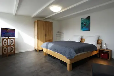 Ein Bett oder Betten in einem Zimmer der Unterkunft Haus zwischen den Deichen Wohnung 3