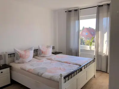 Ein Bett oder Betten in einem Zimmer der Unterkunft Lotus 5