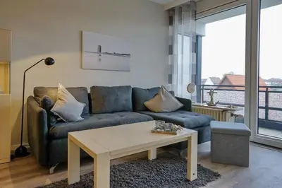 Ein Sitzbereich in der Unterkunft Viktoriastraße 5 Morgensonne inkl Strandkorb am Deich