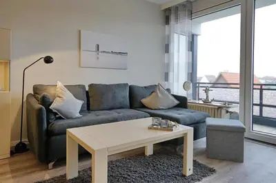 Ein Sitzbereich in der Unterkunft Viktoriastraße 5 Morgensonne inkl Strandkorb am Deich