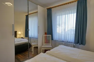 Ein Bett oder Betten in einem Zimmer der Unterkunft Schloss am Meer Wohnung 31