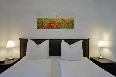 Ein Bett oder Betten in einem Zimmer der Unterkunft Schloss am Meer Wohnung 31