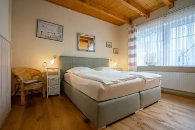 Ein Bett oder Betten in einem Zimmer der Unterkunft Godewind Haus Wattwurm