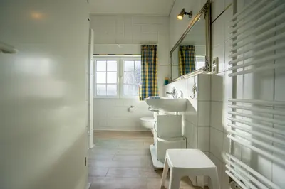 Ein Badezimmer in der Unterkunft Klaar Kimming Haus Wattwurm