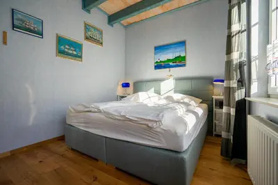 Ein Bett oder Betten in einem Zimmer der Unterkunft Klaar Kimming Haus Wattwurm
