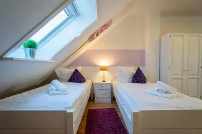 Ein Bett oder Betten in einem Zimmer der Unterkunft Residenz Rosengarten Wohnung 305 mit Meerblick