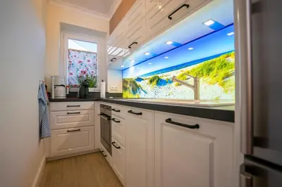 Küche/Küchenzeile in der Unterkunft Hohenzollernpassage Wohnung Nordseeidyll