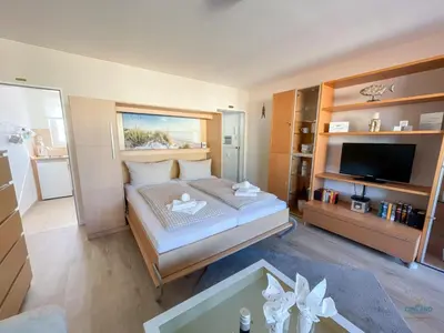 Ein Bett oder Betten in einem Zimmer der Unterkunft Haus Alte Liebe Whg 404 Utkiek