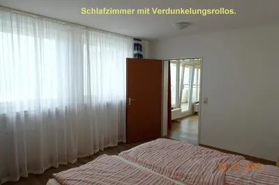 Ein Bett oder Betten in einem Zimmer der Unterkunft Panorama Whg 89, 6 OG