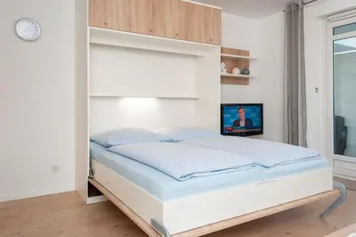 Ein Bett oder Betten in einem Zimmer der Unterkunft Haus Hanseatic, Wohnung 112