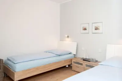 Ein Bett oder Betten in einem Zimmer der Unterkunft Haus Hanseatic, Wohnung 112