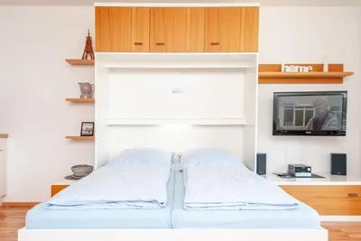 Ein Bett oder Betten in einem Zimmer der Unterkunft Haus Hanseatic, Wohnung 211