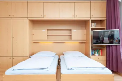 Ein Bett oder Betten in einem Zimmer der Unterkunft Haus Hanseatic, Wohnung 309