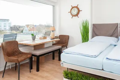 Ein Bett oder Betten in einem Zimmer der Unterkunft Haus Hanseatic, Wohnung 310