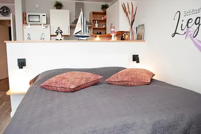 Ein Bett oder Betten in einem Zimmer der Unterkunft Haus Hanseatic, Wohnung 311