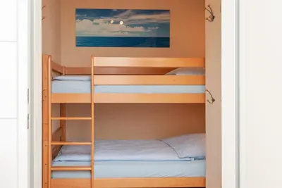 Ein Bett oder Betten in einem Zimmer der Unterkunft Haus Hanseatic, Wohnung 411
