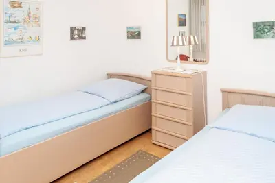 Ein Bett oder Betten in einem Zimmer der Unterkunft Haus Hanseatic, Wohnung 512