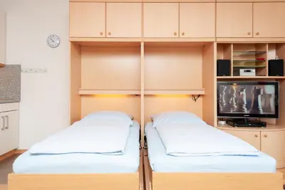 Ein Bett oder Betten in einem Zimmer der Unterkunft Haus Hanseatic, Wohnung 412