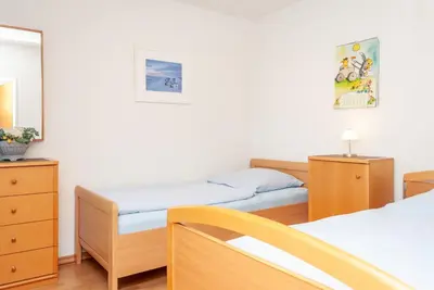 Ein Bett oder Betten in einem Zimmer der Unterkunft Haus Hanseatic, Wohnung 412