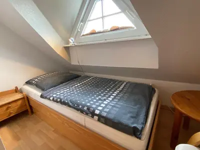 Ein Bett oder Betten in einem Zimmer der Unterkunft Haus Blaubär