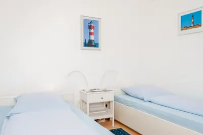 Ein Bett oder Betten in einem Zimmer der Unterkunft Haus Hanseatic, Wohnung 612