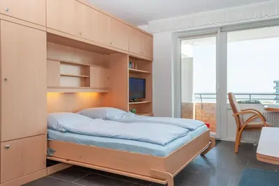 Ein Bett oder Betten in einem Zimmer der Unterkunft Haus Hanseatic, Wohnung 711