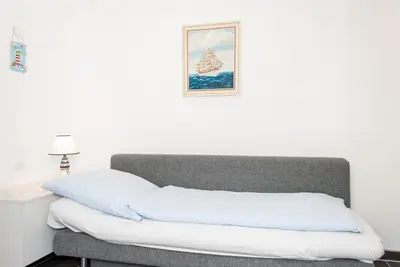 Ein Bett oder Betten in einem Zimmer der Unterkunft Haus Hanseatic, Wohnung 711