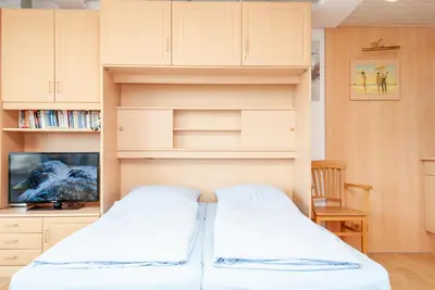 Ein Bett oder Betten in einem Zimmer der Unterkunft Haus Hanseatic, Wohnung 802