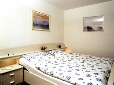 Ein Bett oder Betten in einem Zimmer der Unterkunft Haus Nordseegruß 3