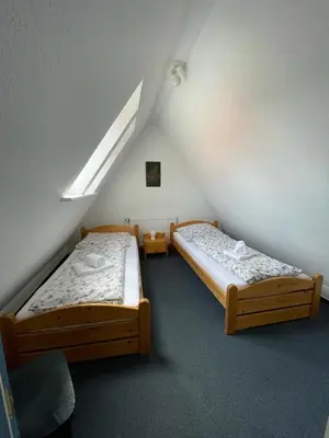 Ein Bett oder Betten in einem Zimmer der Unterkunft Haus Nordseegruß 2