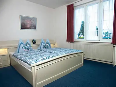 Ein Bett oder Betten in einem Zimmer der Unterkunft Haus Nordseegruß 2